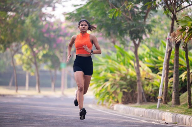 Female runner in a park stock photo